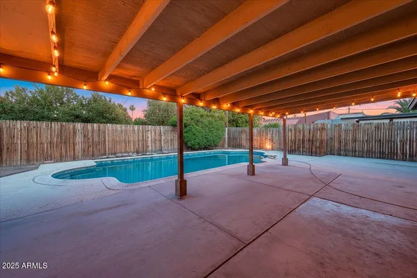 a backyard of a house with a yard and garage
