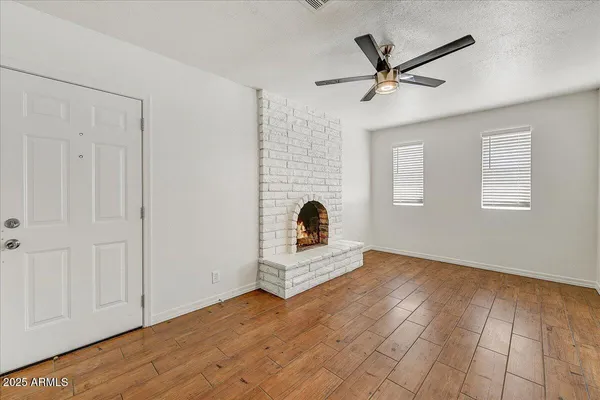 a kitchen with granite countertop a stove top oven sink and cabinets