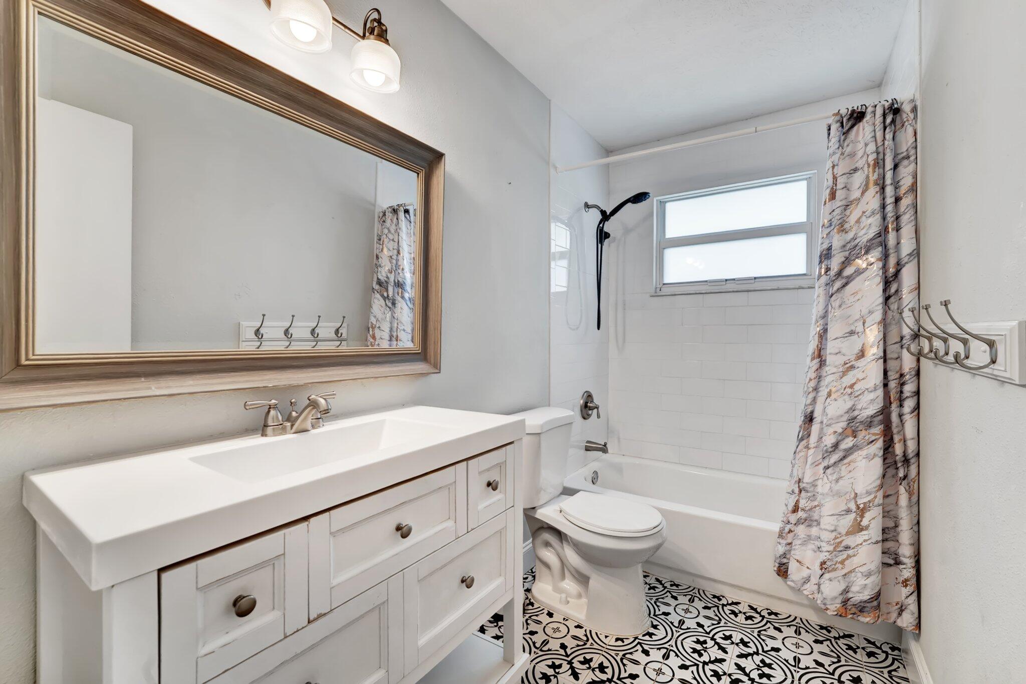 1918 Southeast Cheltenham Street Port St. Lucie, FL 34983 - Photo 11 of 15 Guest bathroom