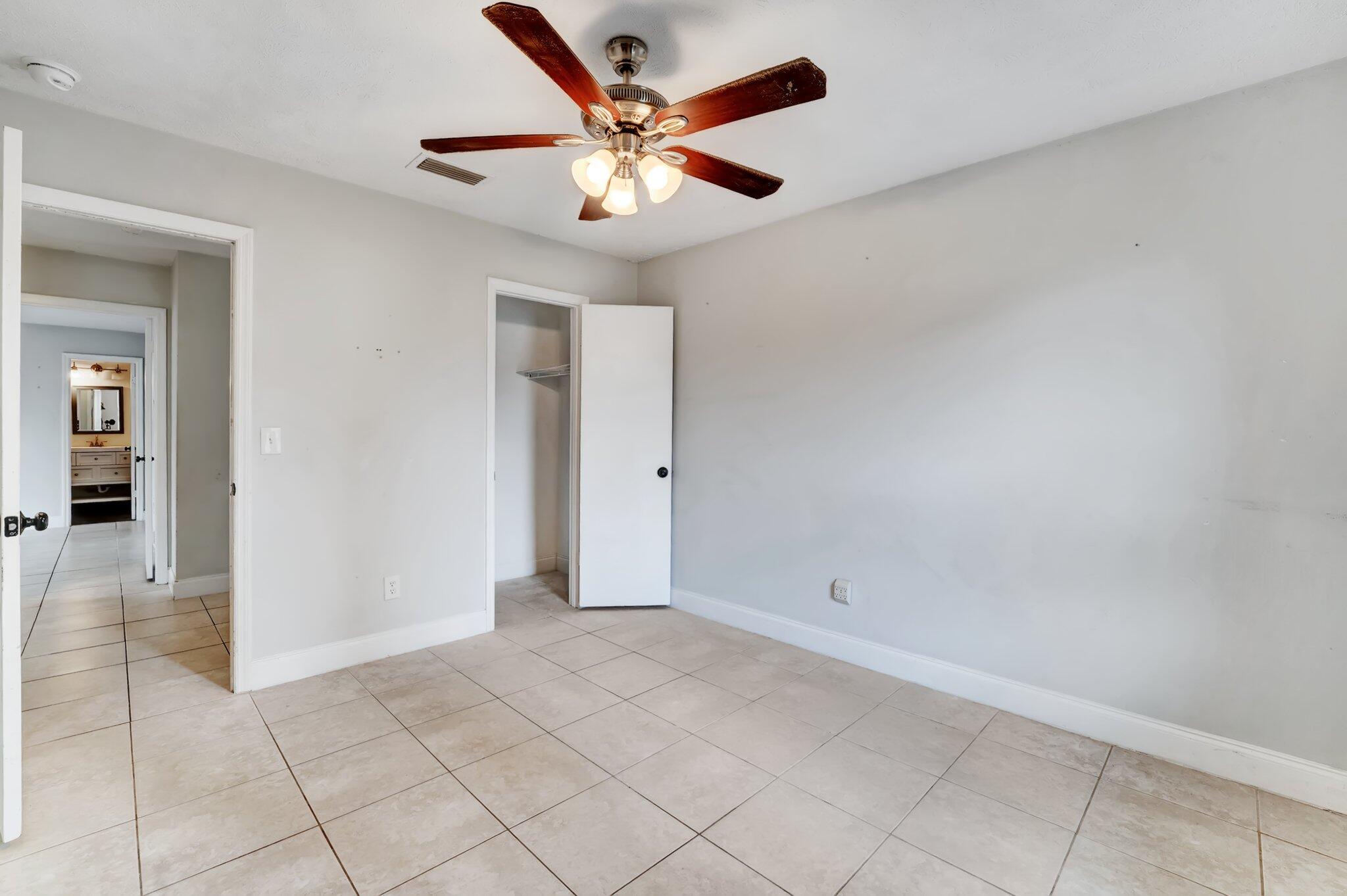 1918 Southeast Cheltenham Street Port St. Lucie, FL 34983 - Photo 13 of 15 3rd bedroom w/ walk-in closet