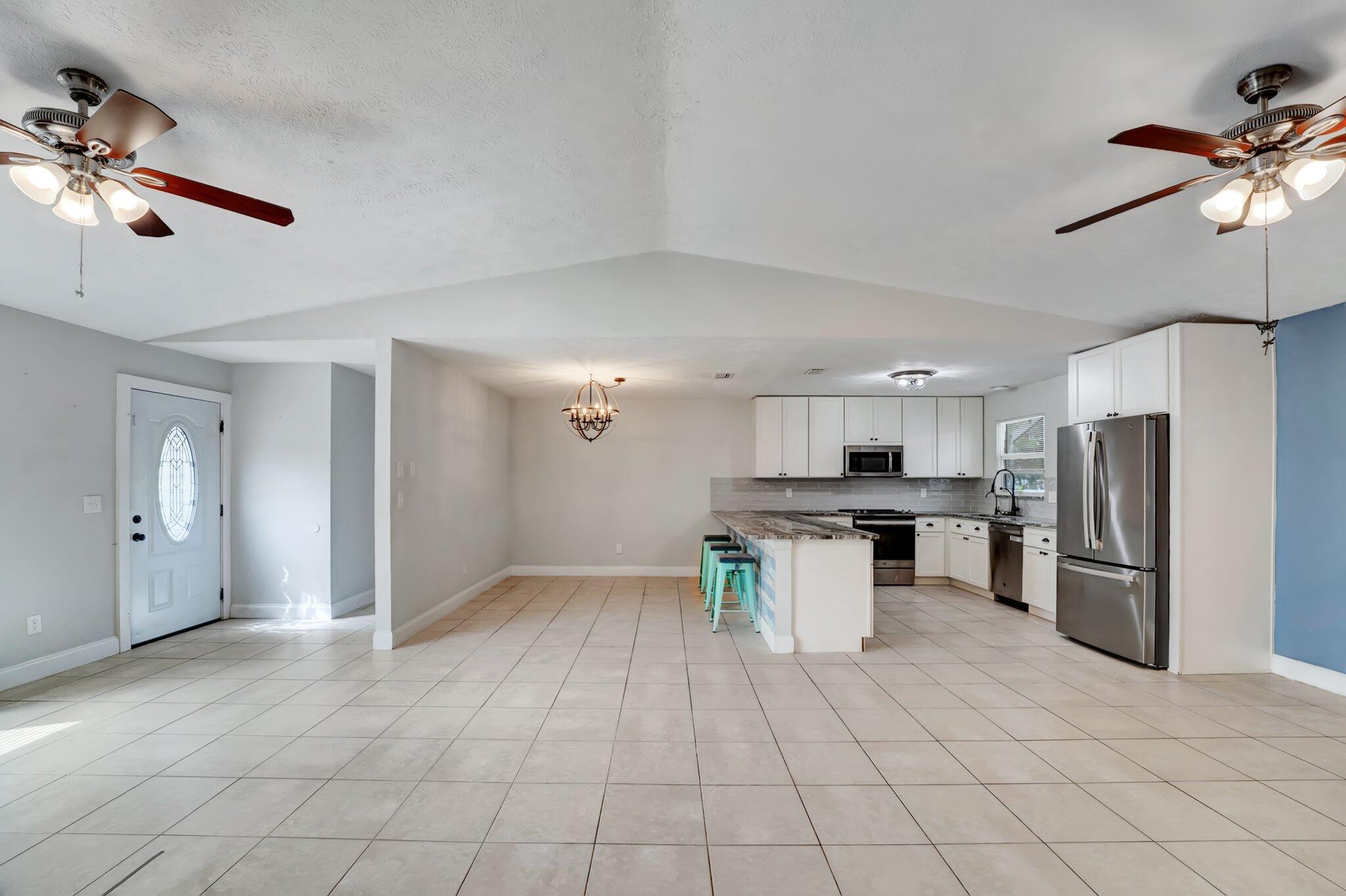 1918 Southeast Cheltenham Street Port St. Lucie, FL 34983 - Photo 6 of 15 Living, dining, kitchen.