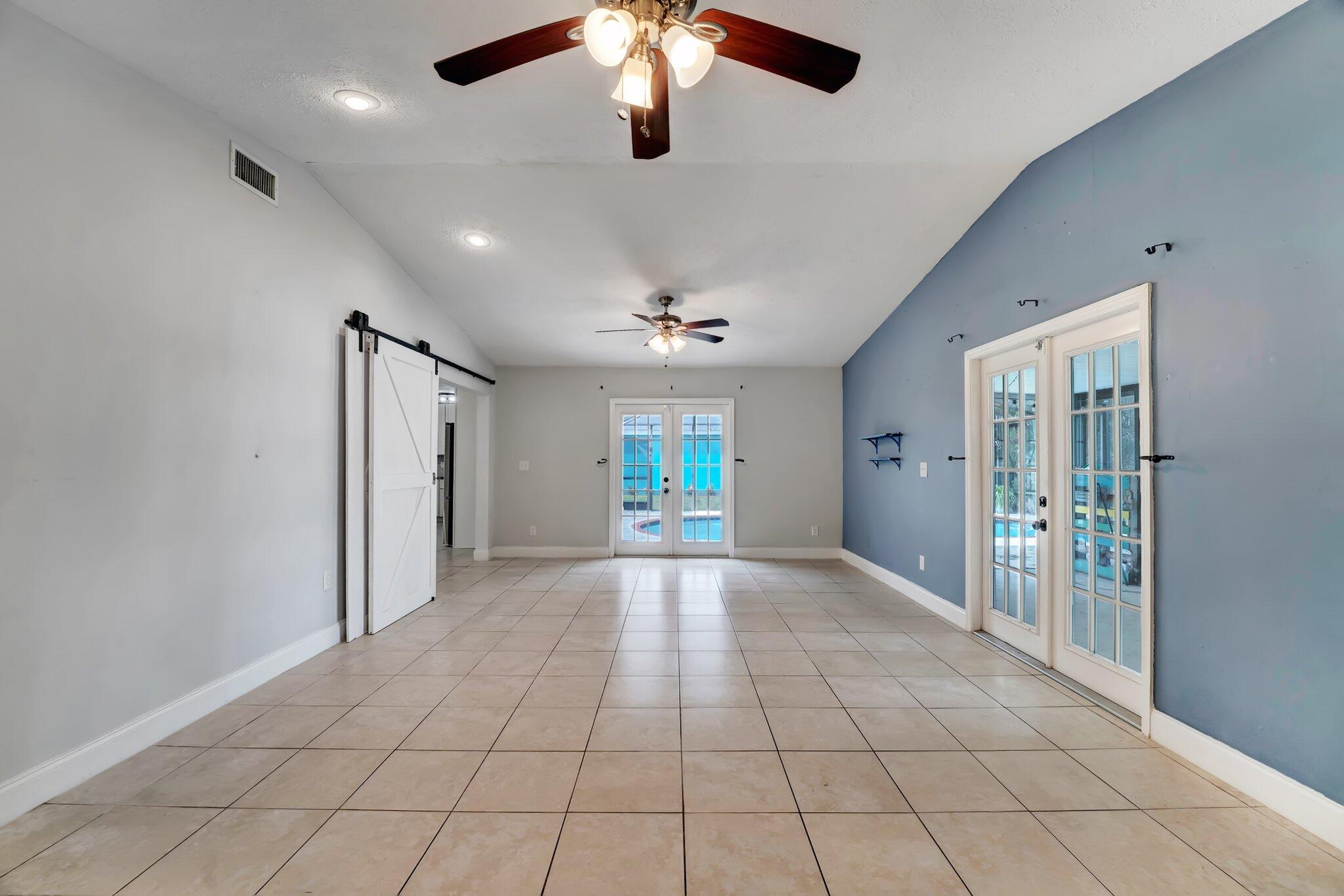 1918 Southeast Cheltenham Street Port St. Lucie, FL 34983 - Photo 8 of 15 flex room to pool/patio