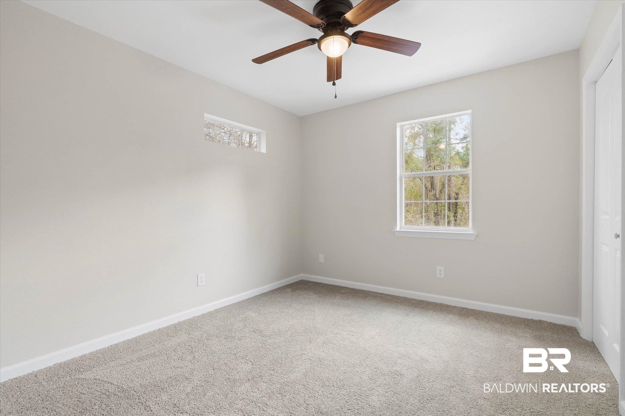 106 Melanie Loop Daphne, AL 36526 - Photo 27 of 45 Empty room with light colored carpet, healthy amount of natural light, and a ceiling fan