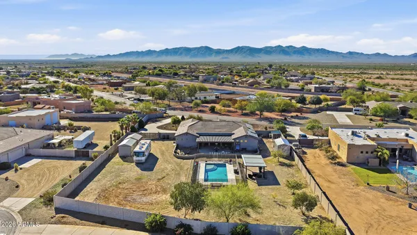 an aerial view of a residential apartment building with a yard