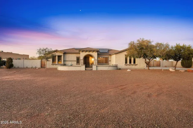 an aerial view of a residential apartment building with a yard