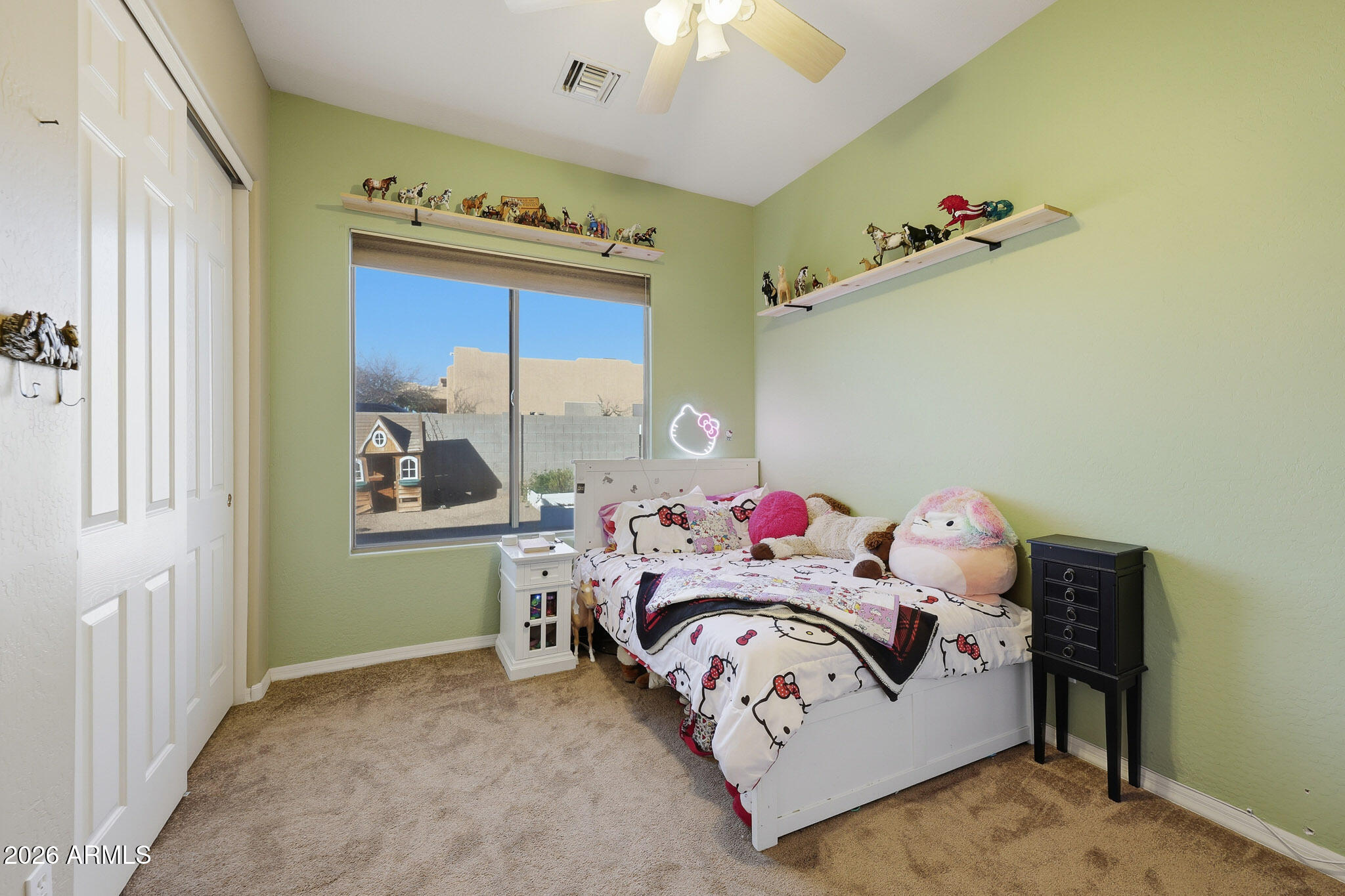 23024 West Sierra Ridge Way Wittmann, AZ 85361 - Photo 11 of 99 a bedroom with a bed and a table