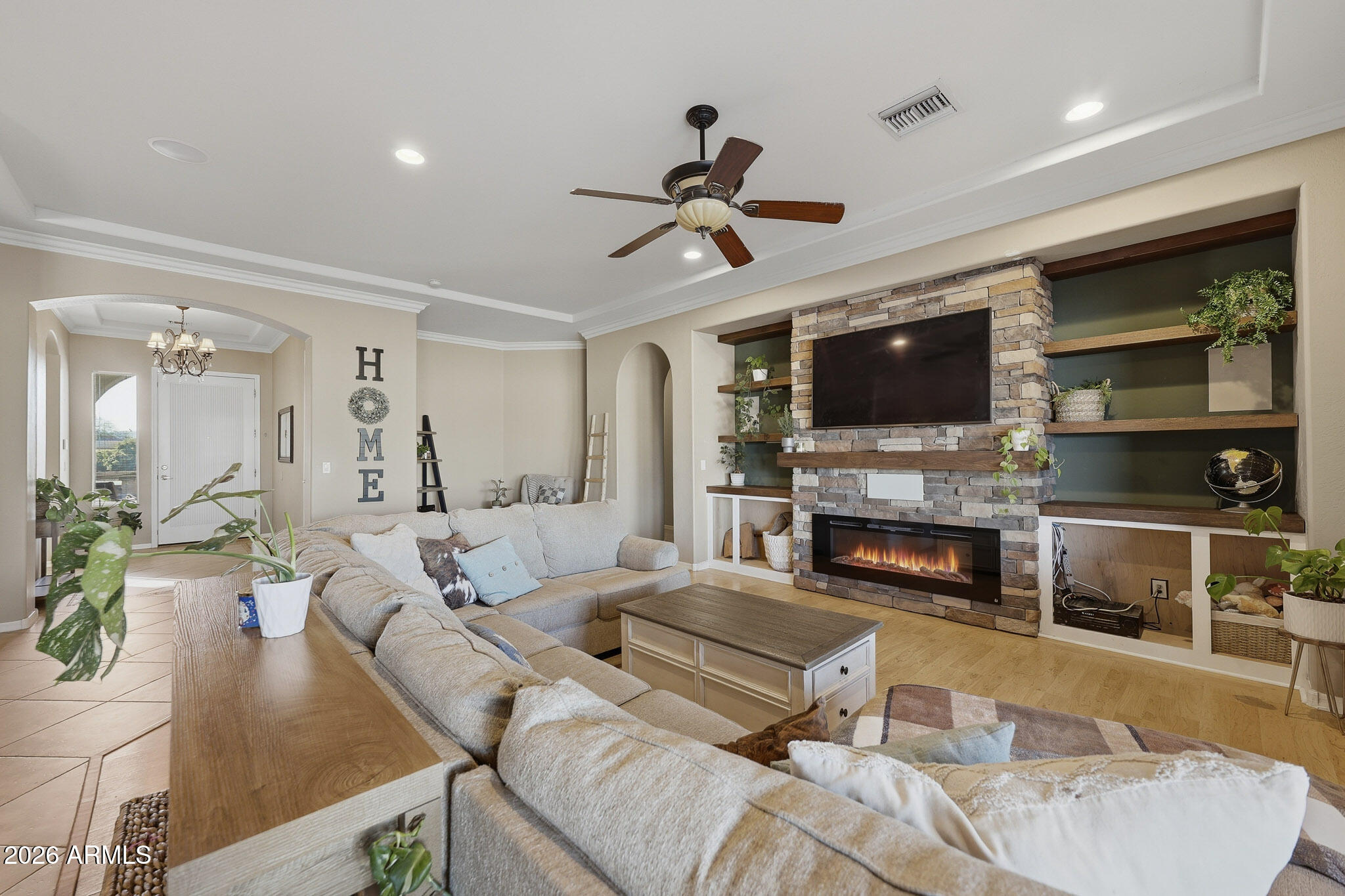 23024 West Sierra Ridge Way Wittmann, AZ 85361 - Photo 26 of 99 a living room with furniture fireplace and flat screen tv