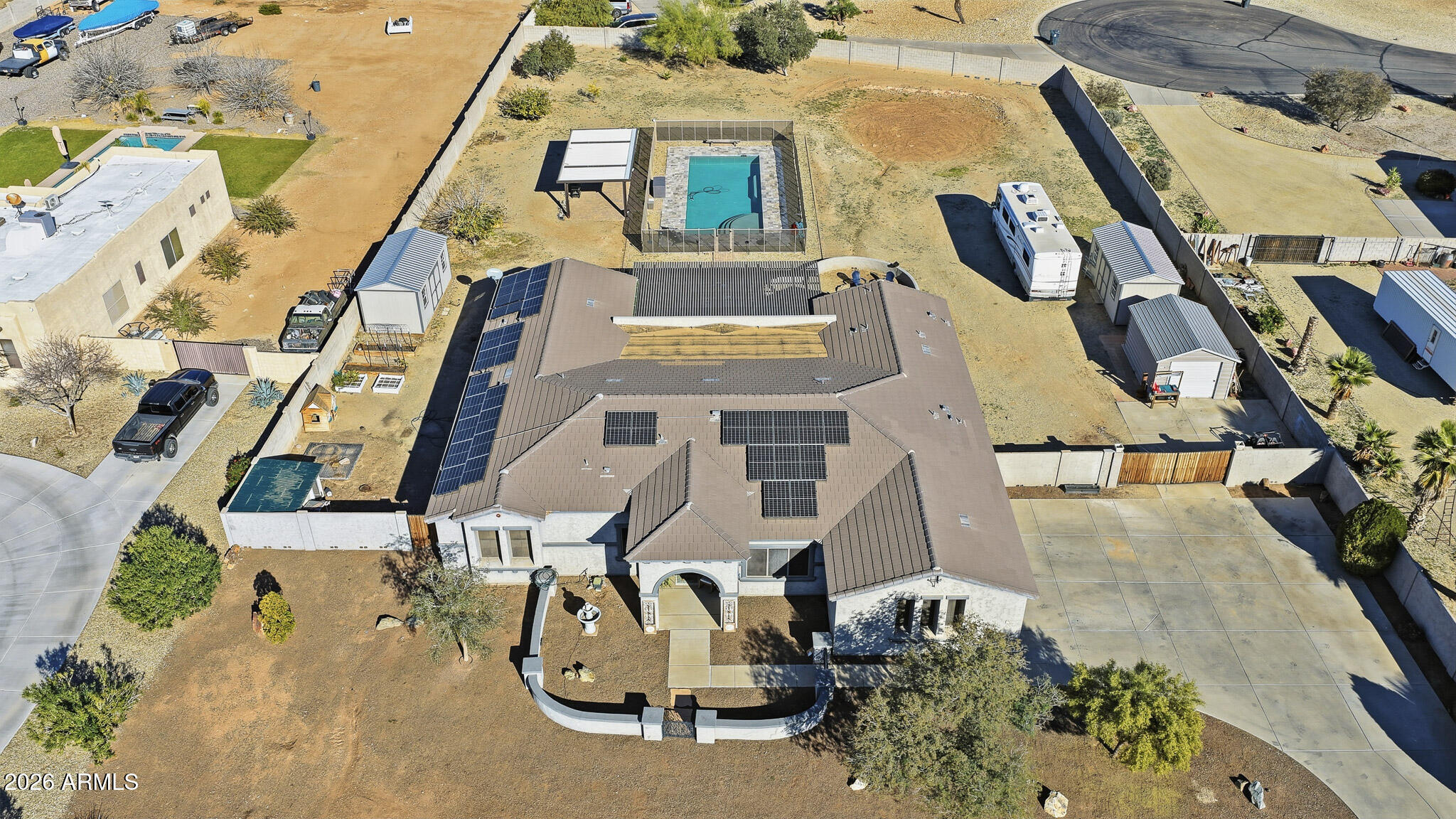23024 West Sierra Ridge Way Wittmann, AZ 85361 - Photo 3 of 99 an aerial view of a residential apartment building with a yard