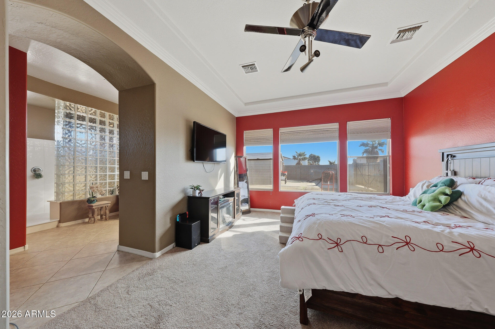 23024 West Sierra Ridge Way Wittmann, AZ 85361 - Photo 40 of 99 a living room with a bed furniture and a large window