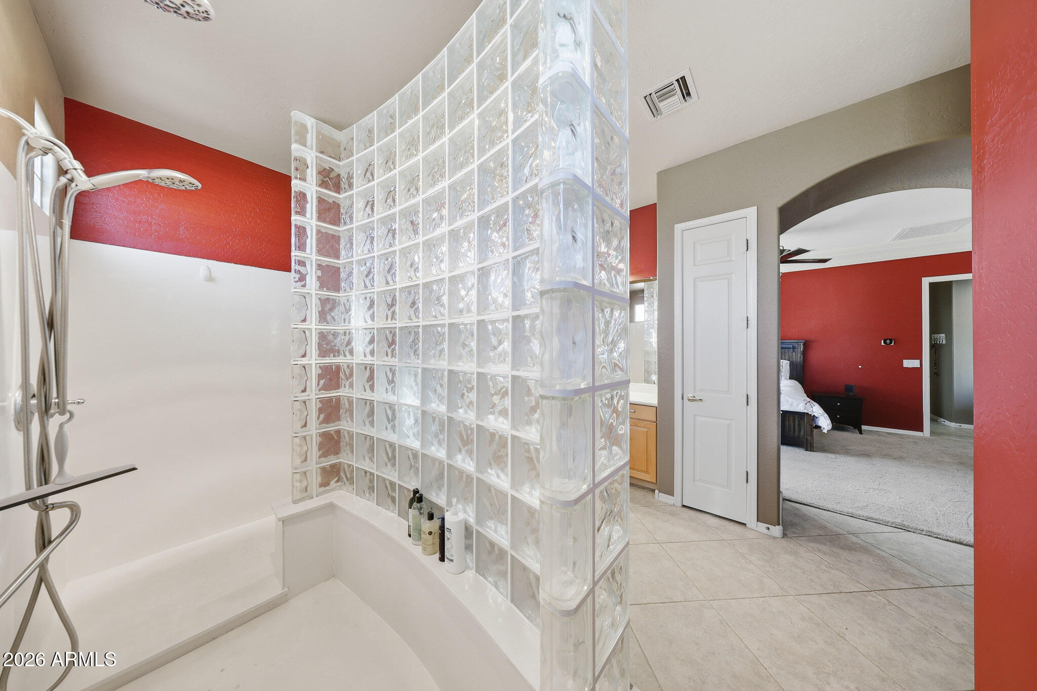 23024 West Sierra Ridge Way Wittmann, AZ 85361 - Photo 44 of 99 a bathroom with a bathtub and shower