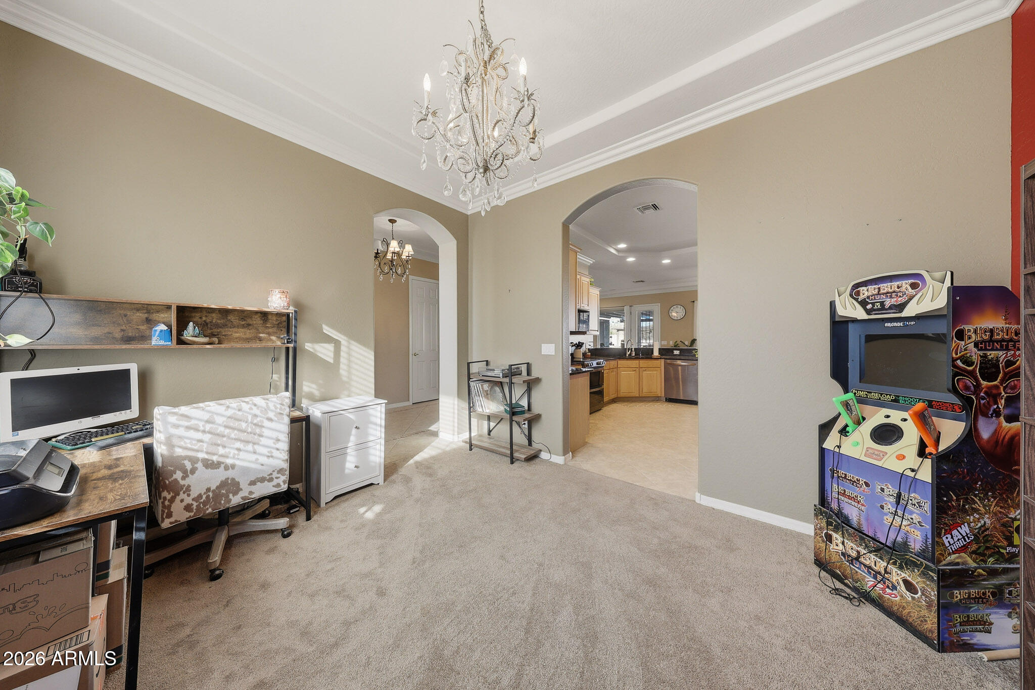 23024 West Sierra Ridge Way Wittmann, AZ 85361 - Photo 46 of 99 a bedroom with furniture and a chandelier