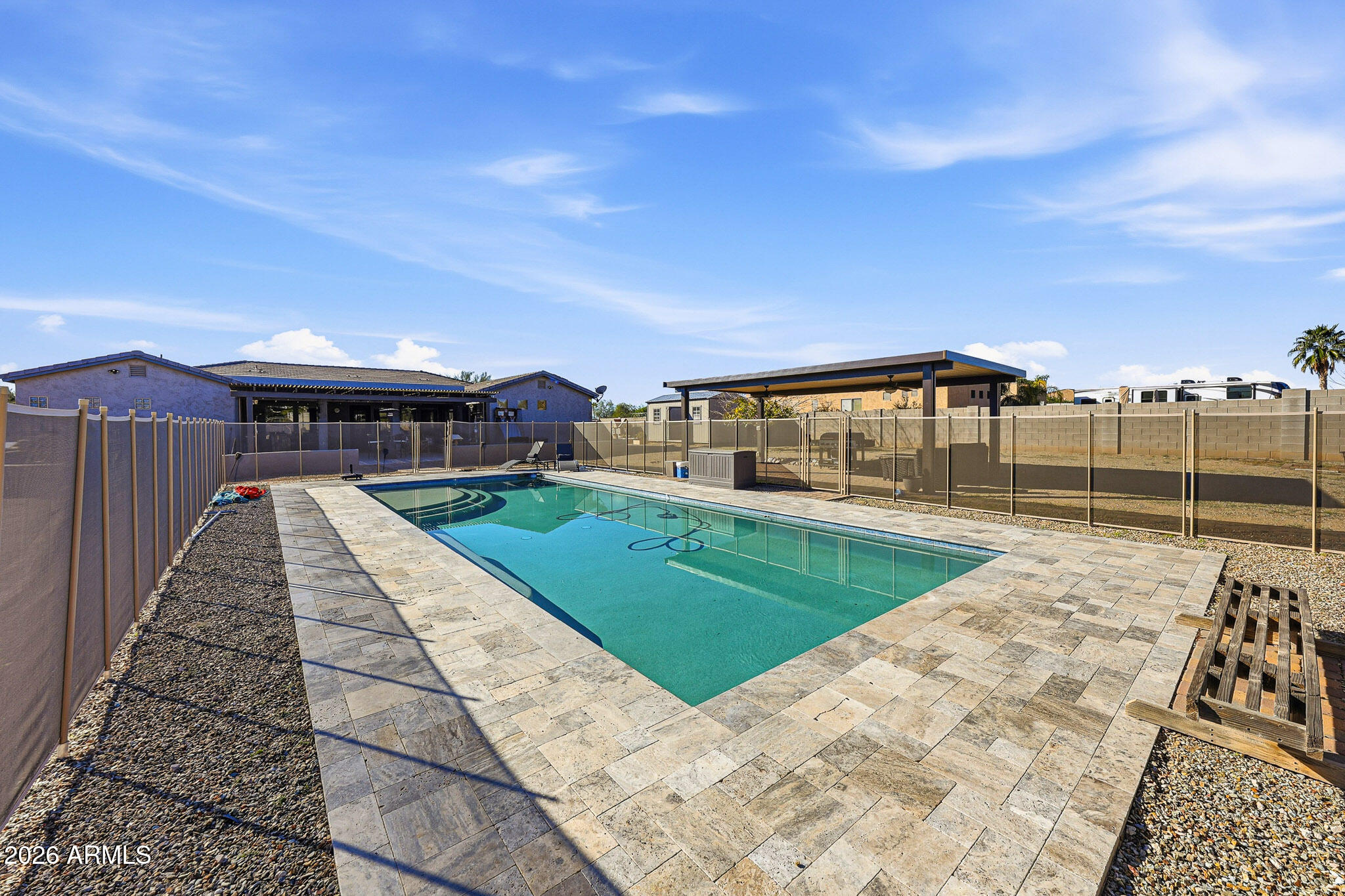 23024 West Sierra Ridge Way Wittmann, AZ 85361 - Photo 48 of 99 a view of a swimming pool with a lounge chairs