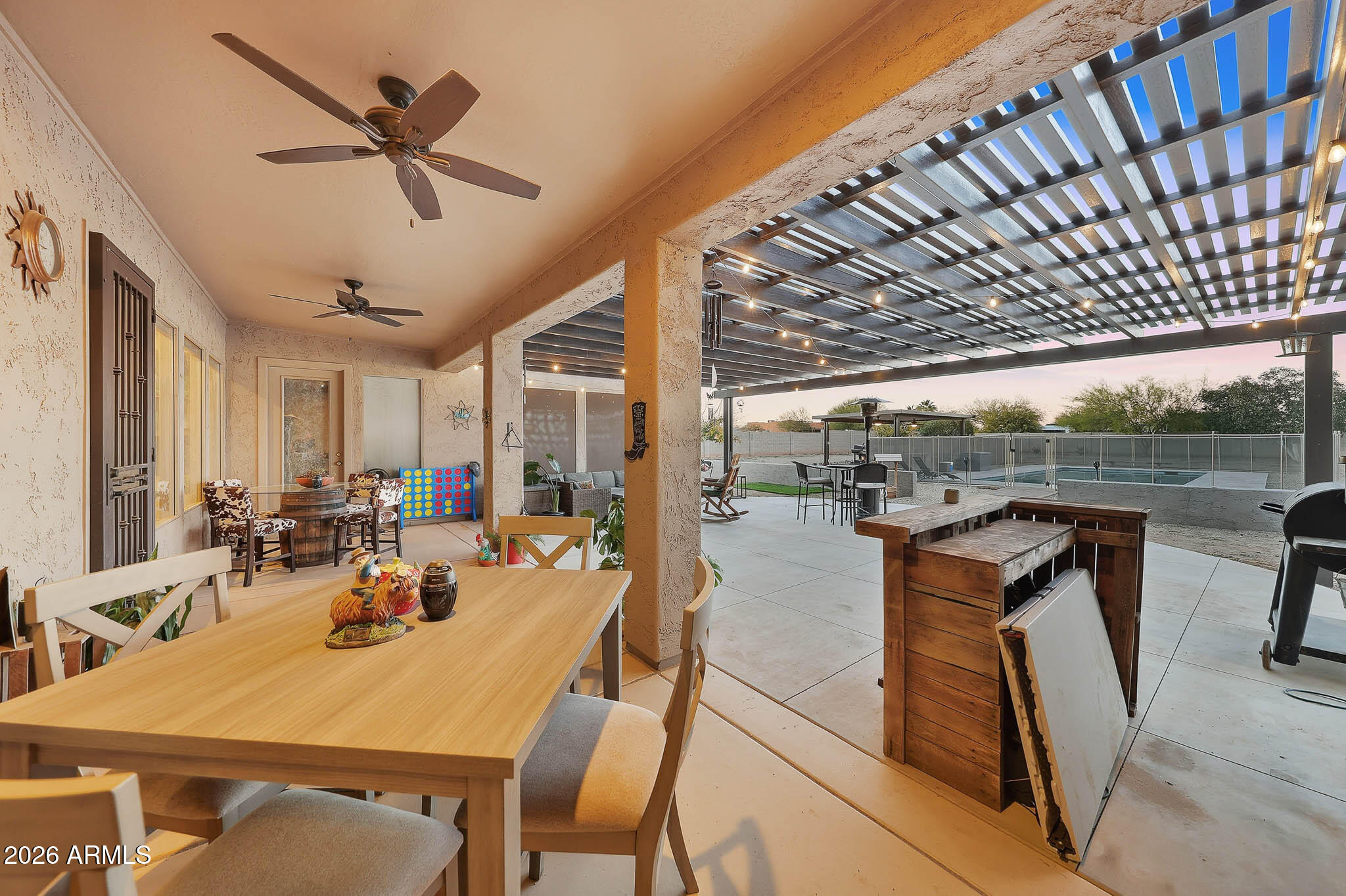 23024 West Sierra Ridge Way Wittmann, AZ 85361 - Photo 76 of 99 a view of a dining room with furniture window and outside view