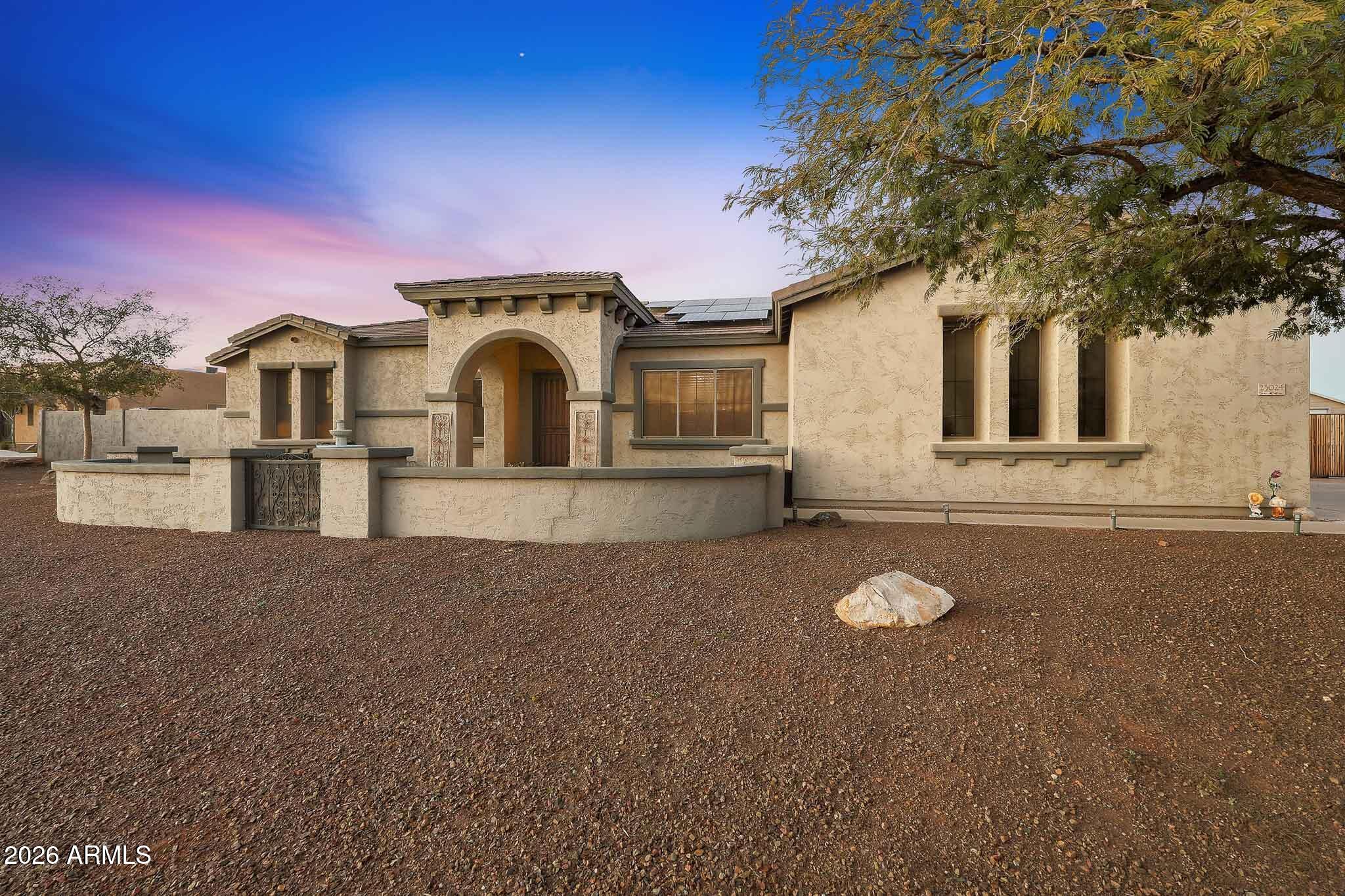 23024 West Sierra Ridge Way Wittmann, AZ 85361 - Photo 95 of 99 a front view of a house with a yard