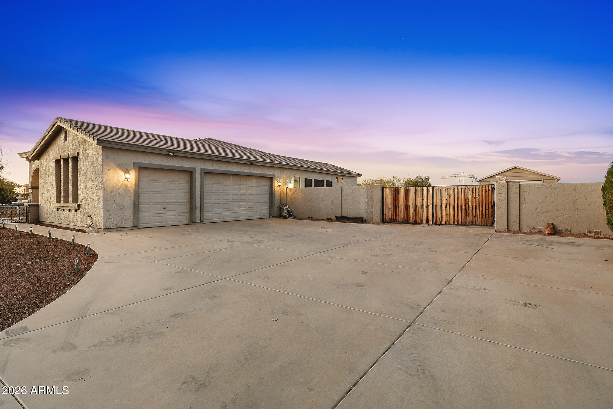23024 West Sierra Ridge Way Wittmann, AZ 85361 - Photo 97 of 99 a view of a house with a garage