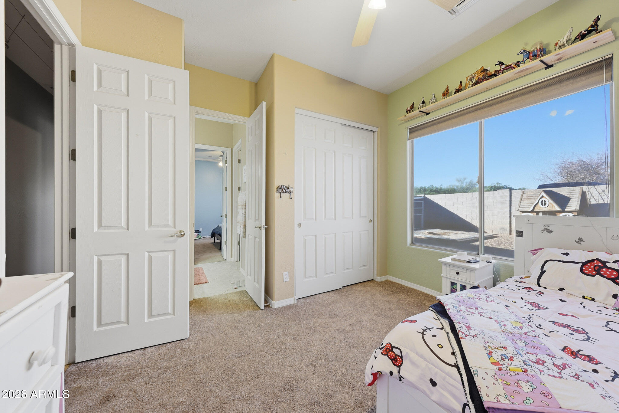23024 West Sierra Ridge Way Wittmann, AZ 85361 - Photo 10 of 99 a bedroom with a bed and a window
