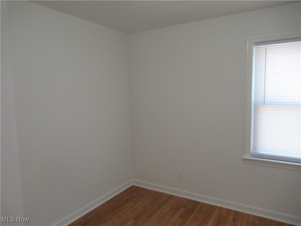 1397 Sunset Road Cleveland, OH 44124 - Photo 14 of 32 Unfurnished room featuring wood finished floors and baseboards