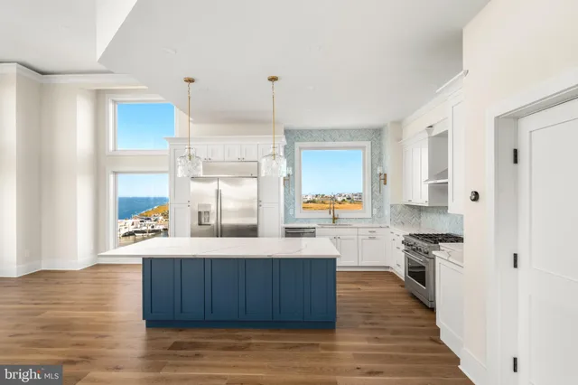a view of an empty room with window and fire place