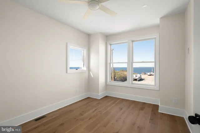 a view of a white building with ocean view