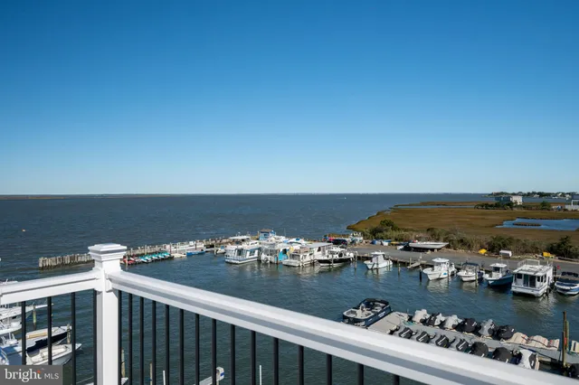 an aerial view of a house with ocean view