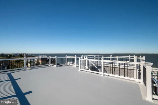 a view of residential houses with swimming pool and lake view