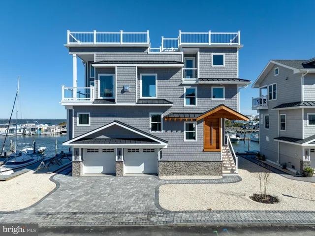 an aerial view of a house with a ocean view
