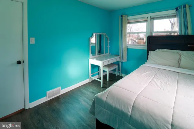 a bedroom with a bed and a table in it