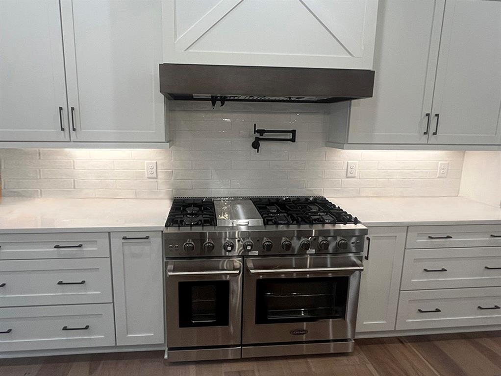 2200 Upper Burris Road Ball Ground, GA 30107 - Photo 18 of 79 a kitchen with stainless steel appliances granite countertop a stove and a cabinets