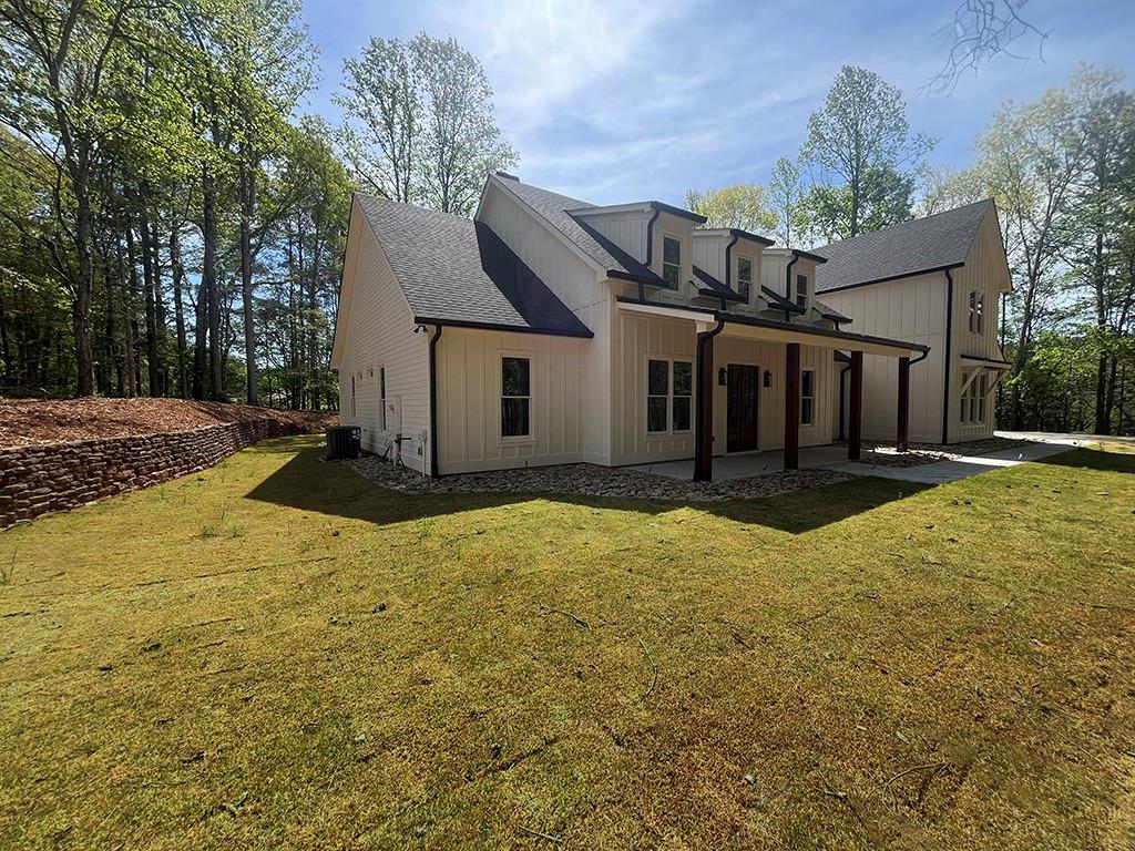 2200 Upper Burris Road Ball Ground, GA 30107 - Photo 3 of 79 a view of a house with a yard