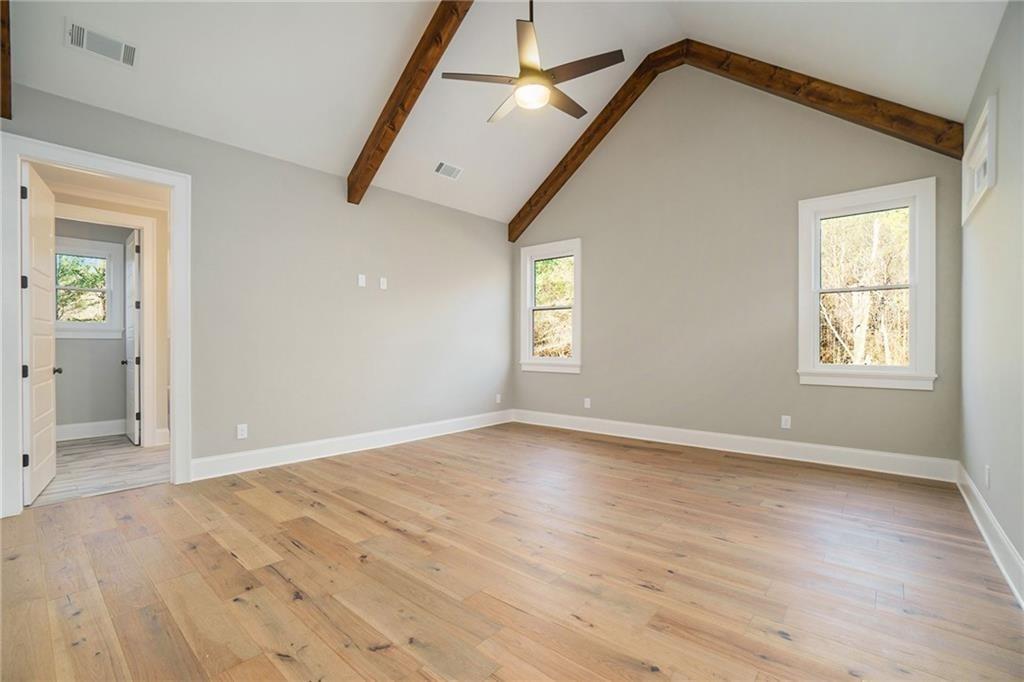 2200 Upper Burris Road Ball Ground, GA 30107 - Photo 55 of 79 an empty room with wooden floor and windows