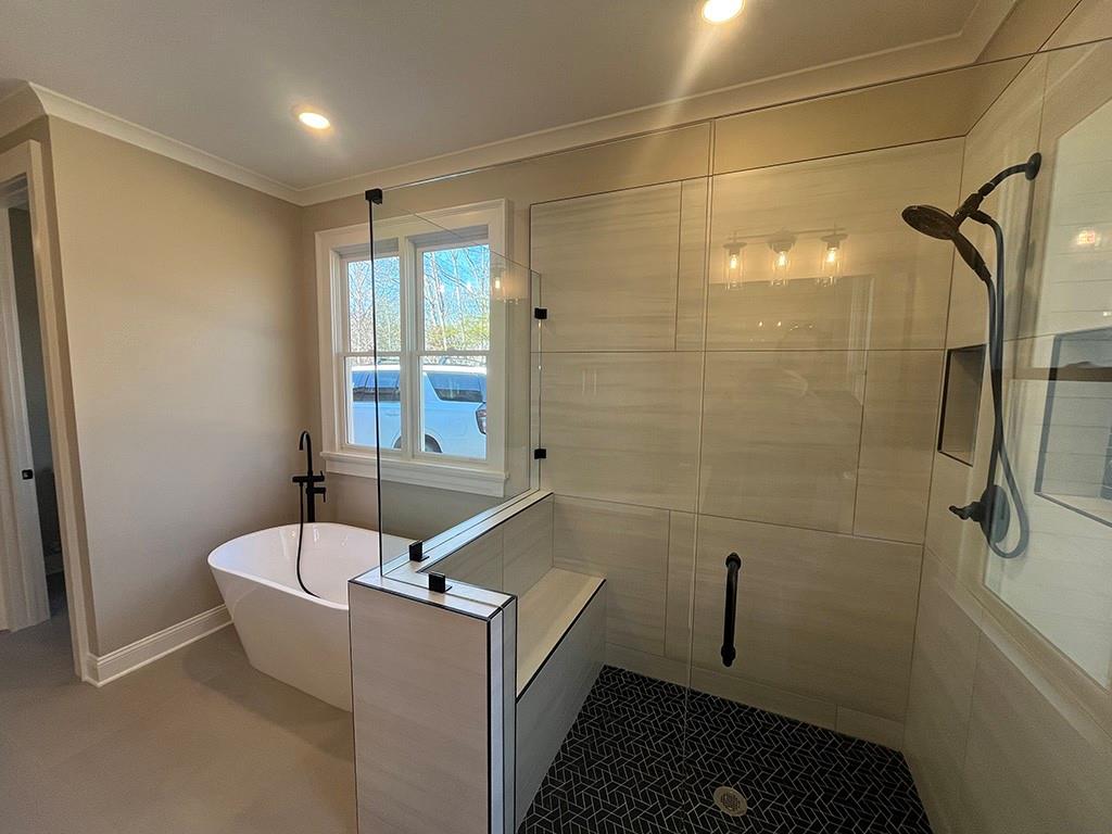 2200 Upper Burris Road Ball Ground, GA 30107 - Photo 64 of 79 a bathroom with a bathtub and shower