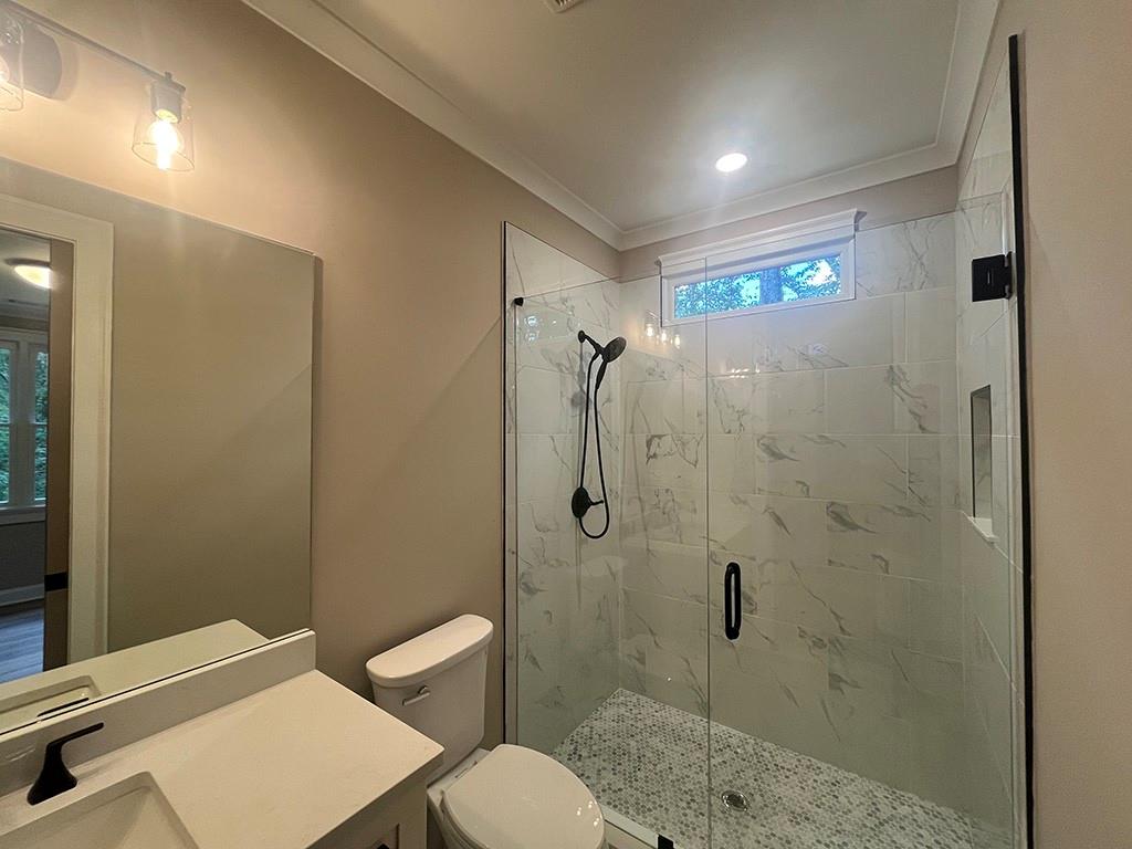 2200 Upper Burris Road Ball Ground, GA 30107 - Photo 73 of 79 a bathroom with a shower a toilet and sink