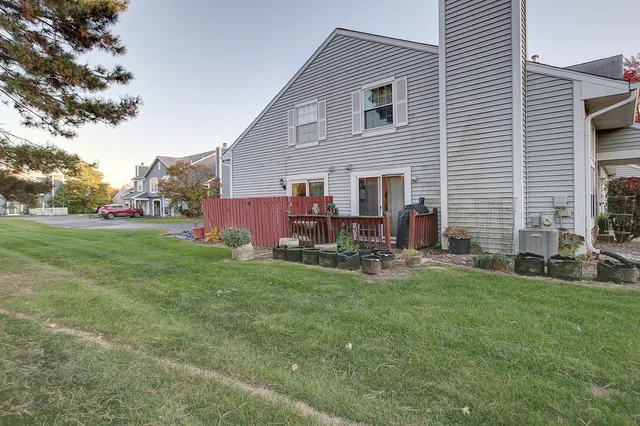 a view of a house with a backyard
