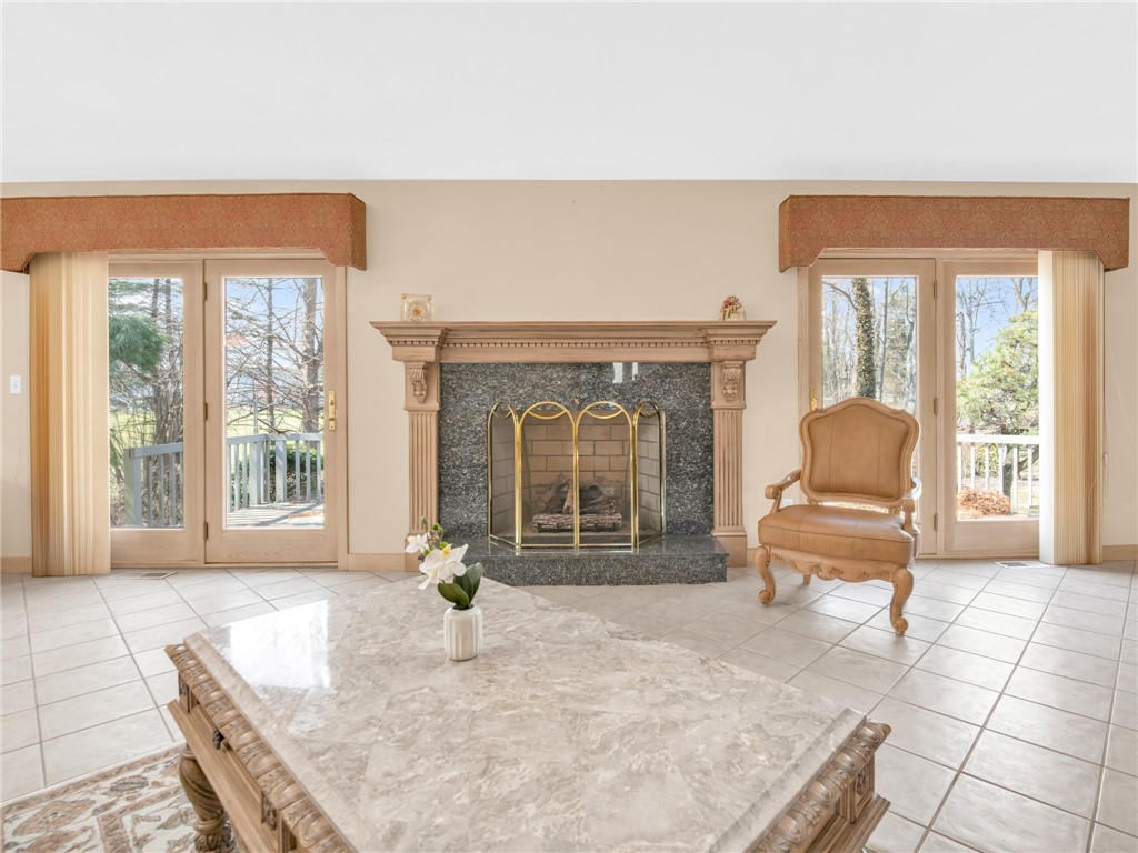 51 Janet Drive Cranston, RI 02921 - Photo 7 of 38 Brick fireplace and doors to deck