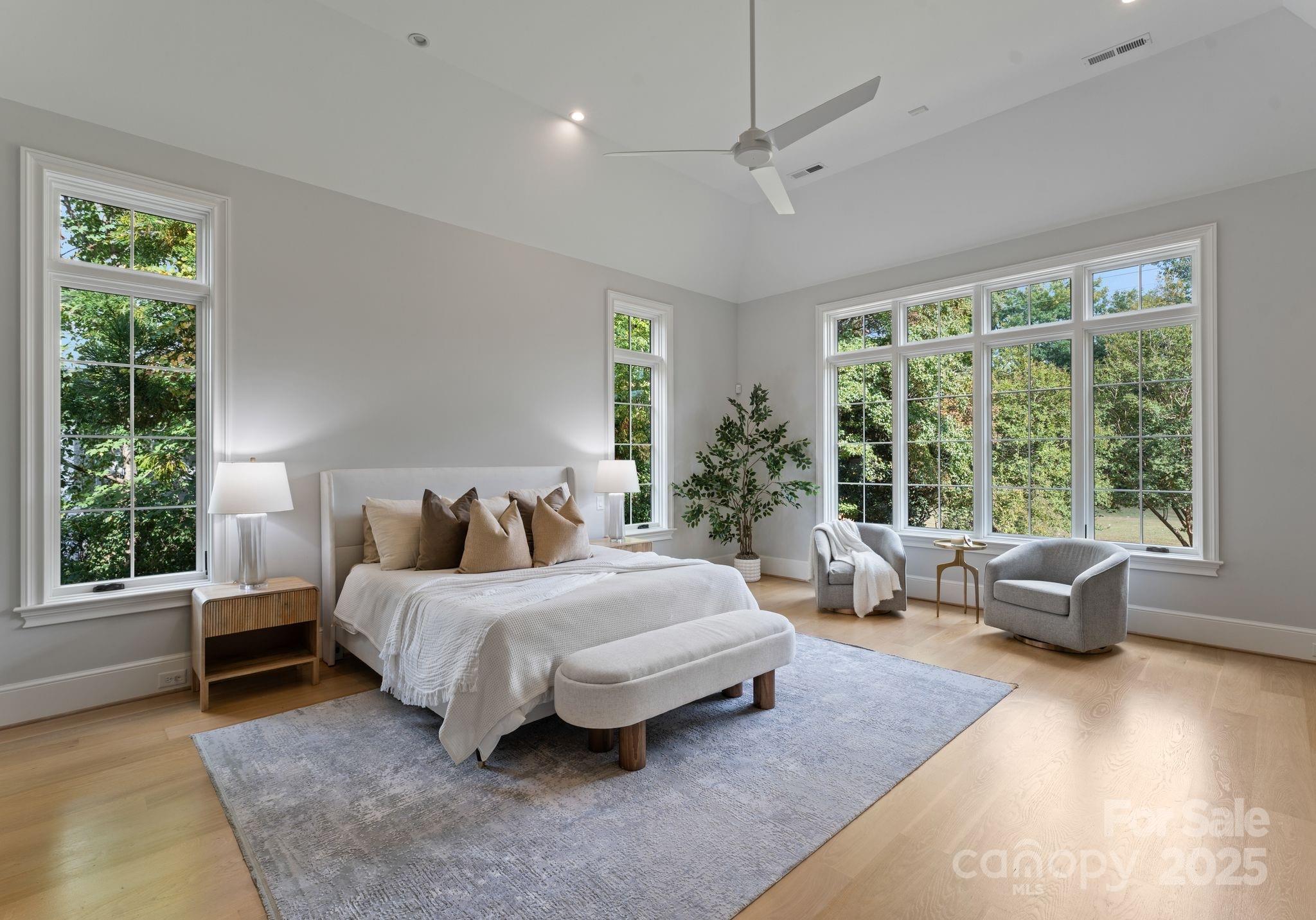 4019 River Ridge Road Charlotte, NC 28226 - Photo 16 of 39 a spacious bedroom with a bed and large windows