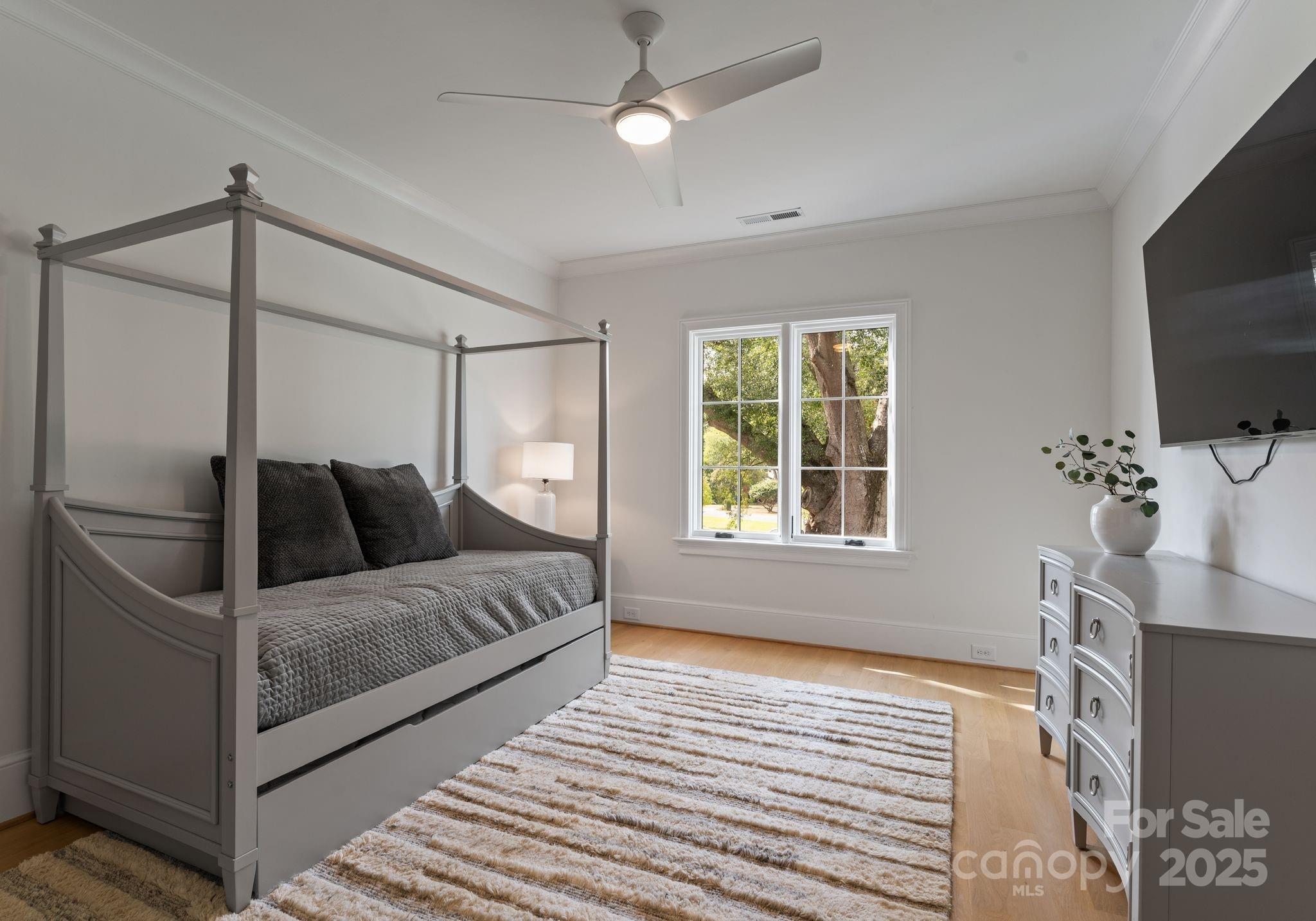 4019 River Ridge Road Charlotte, NC 28226 - Photo 27 of 39 a living room with a bed furniture and a flat screen tv