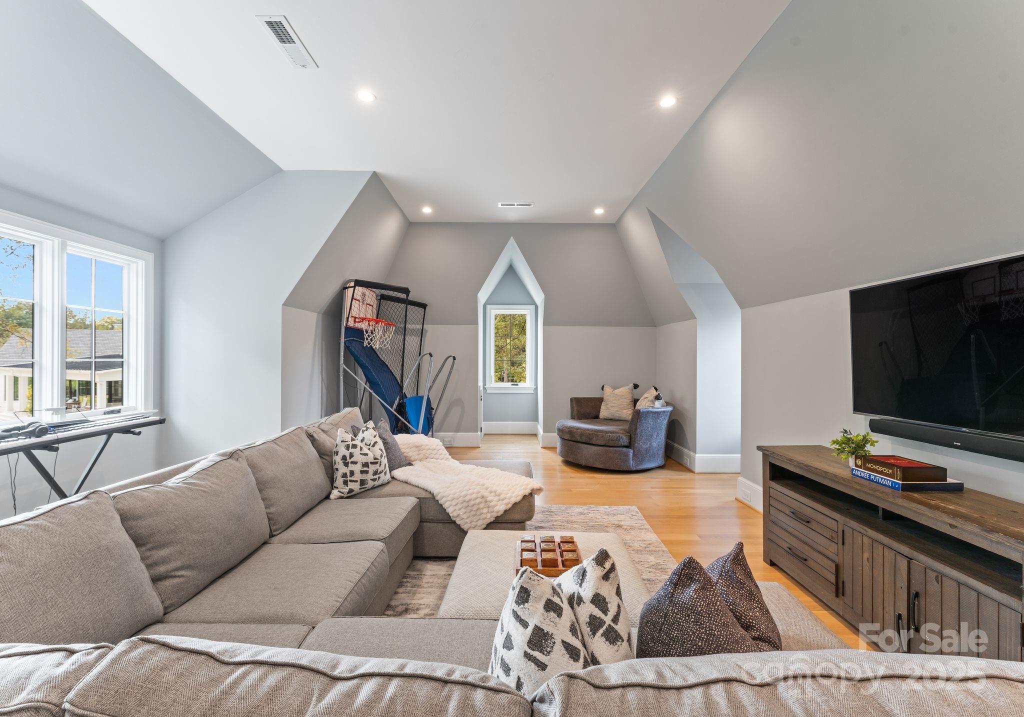 4019 River Ridge Road Charlotte, NC 28226 - Photo 29 of 39 a living room with furniture and a flat screen tv