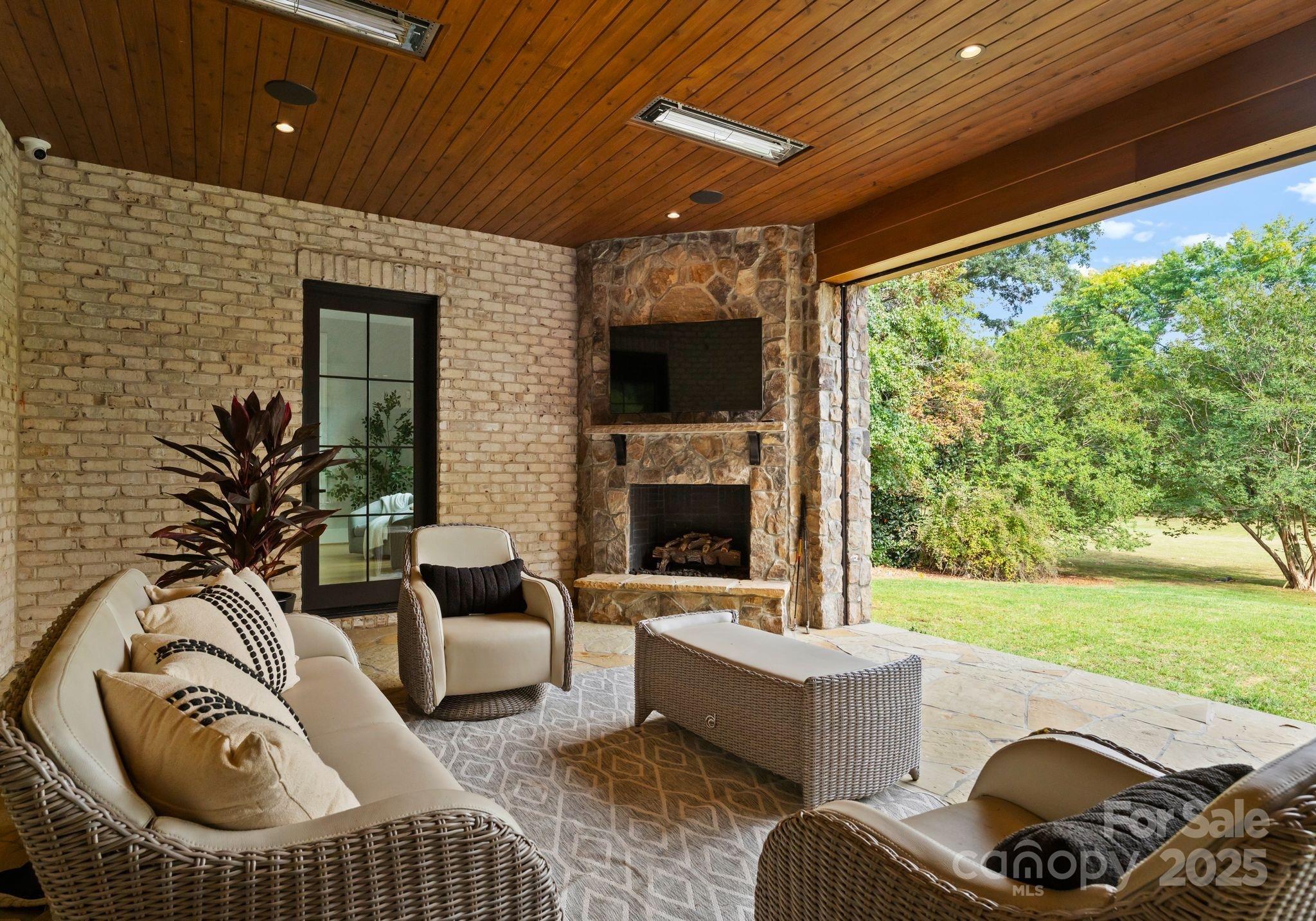 4019 River Ridge Road Charlotte, NC 28226 - Photo 30 of 39 a bedroom with furniture and a fireplace