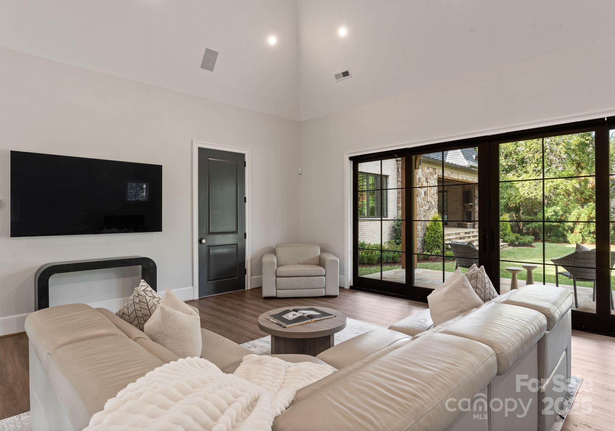 4019 River Ridge Road Charlotte, NC 28226 - Photo 32 of 39 a living room with furniture and a flat screen tv
