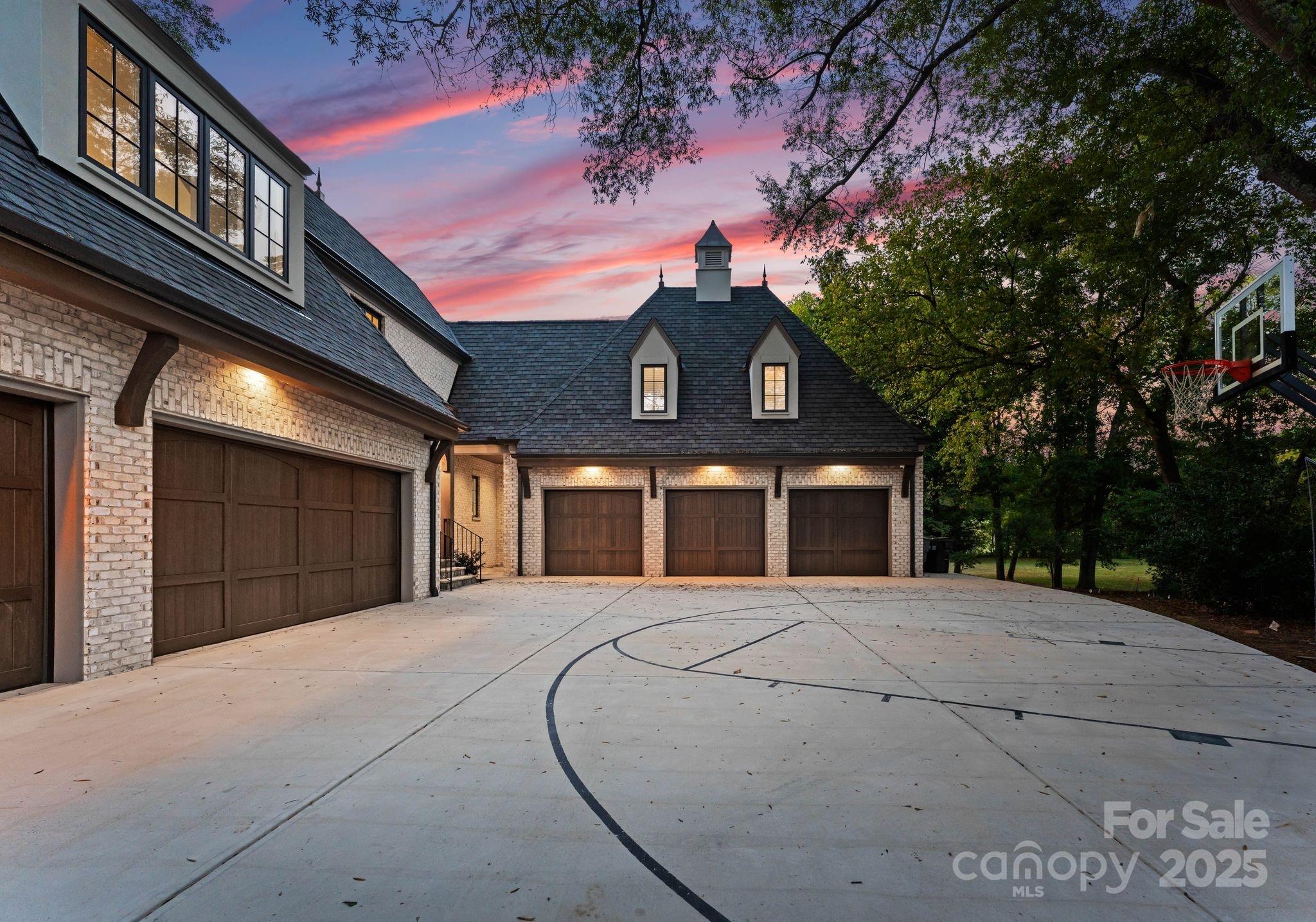 4019 River Ridge Road Charlotte, NC 28226 - Photo 4 of 39 a front view of a building with a yard and garage