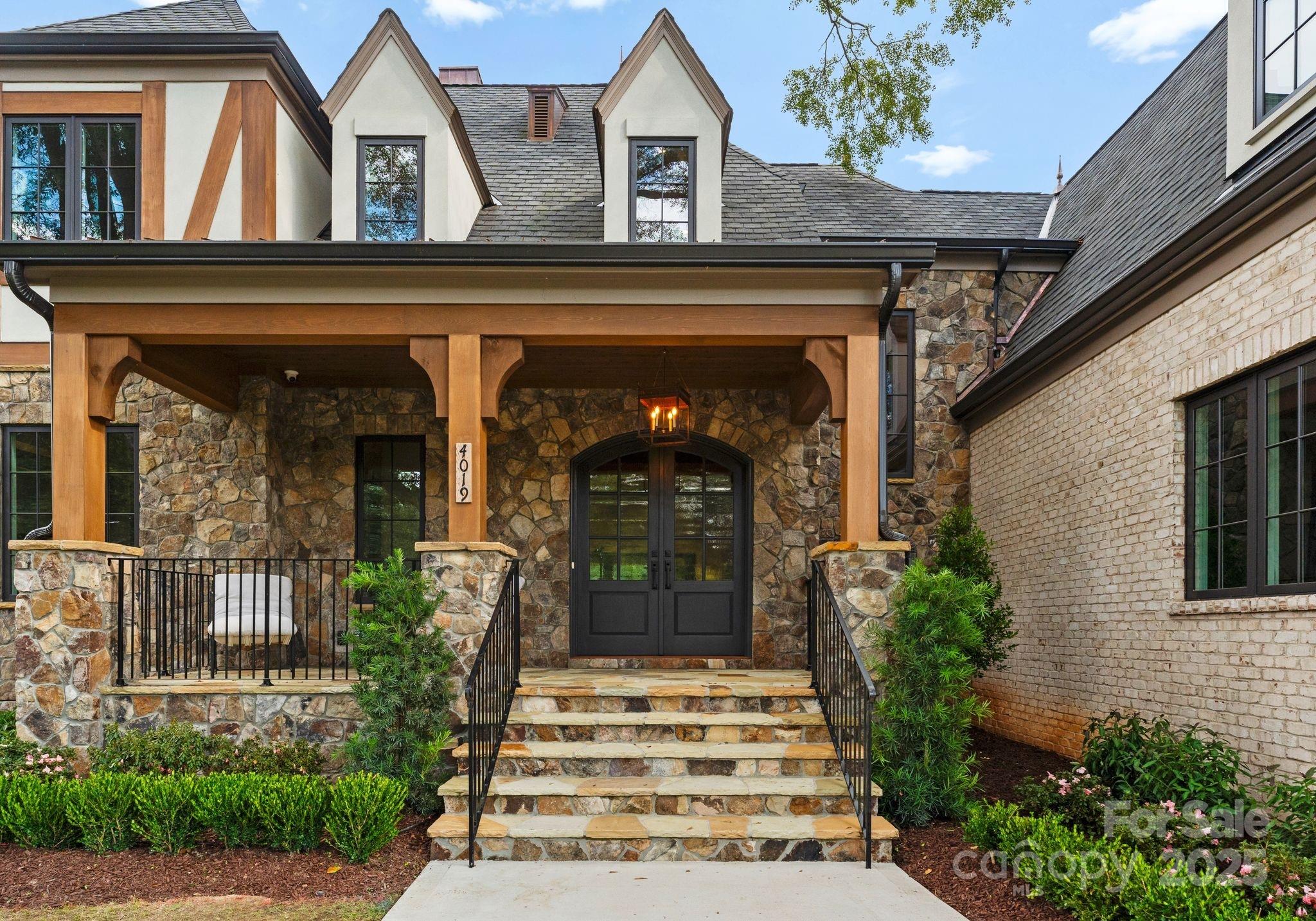 4019 River Ridge Road Charlotte, NC 28226 - Photo 5 of 39 a front view of a house with a porch