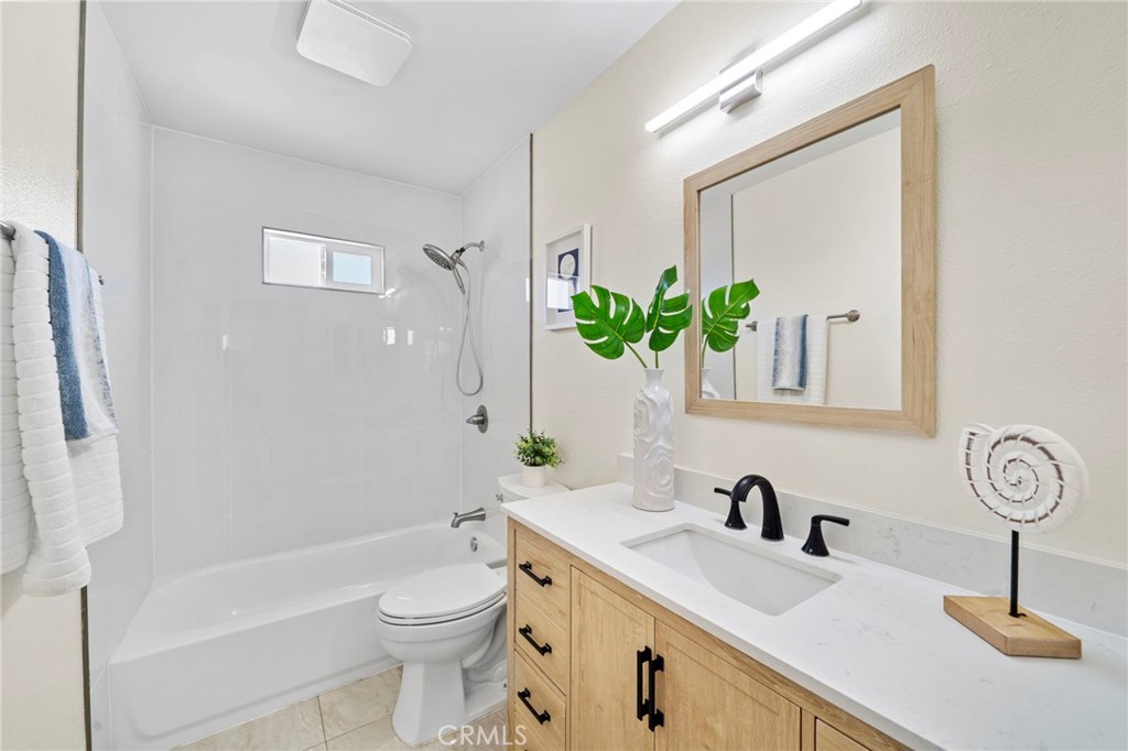 9561 Cardinal Avenue Westminster, CA 92683 - Photo 12 of 34 completely brand new with custom self-closing cabinetry, quartz countertops, designer lighting, and mirrors