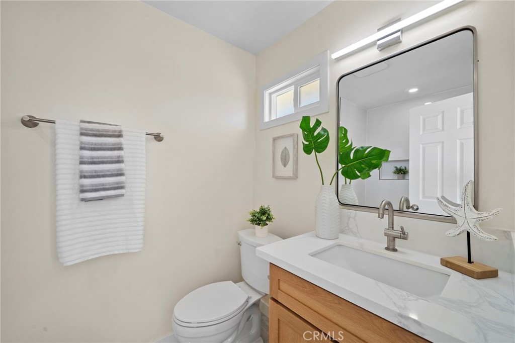 9561 Cardinal Avenue Westminster, CA 92683 - Photo 19 of 34 Both bathrooms are completely brand new with custom self-closing cabinetry, quartz countertops, designer lighting, and mirrors