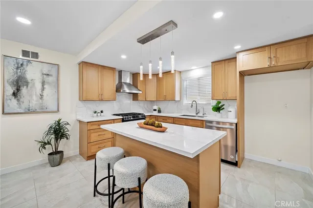a view of a dining room with furniture and a large window