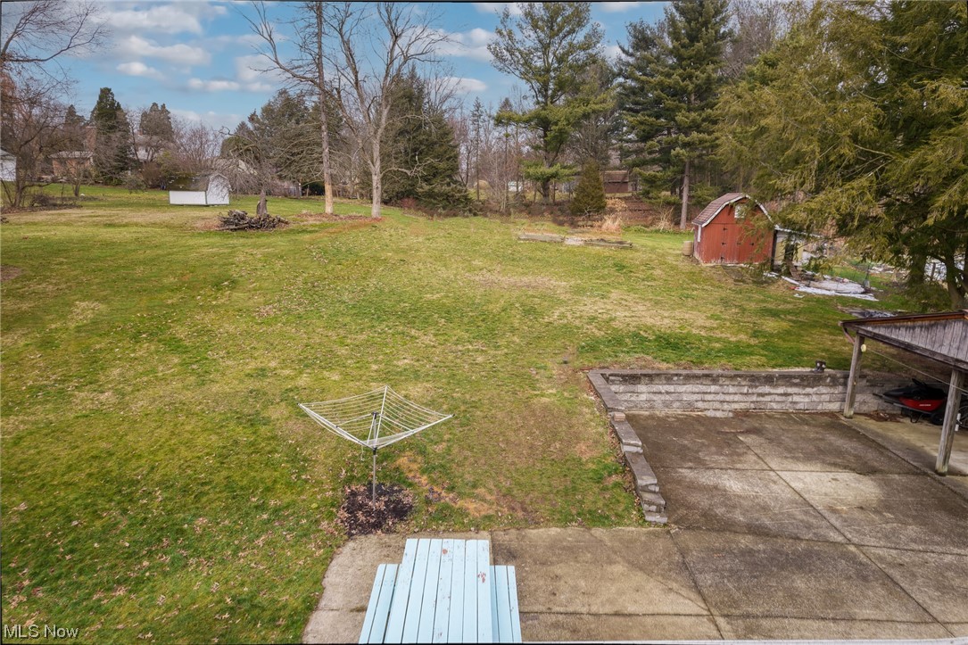 227 South Messner Road New Franklin, OH 44319 - Photo 10 of 44 View of yard featuring a storage shed
