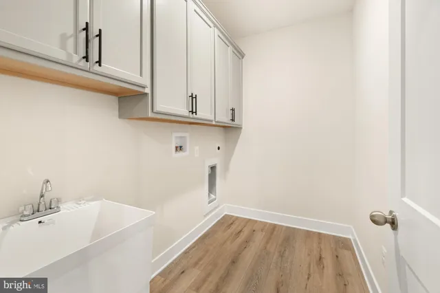 an empty room with wooden floor