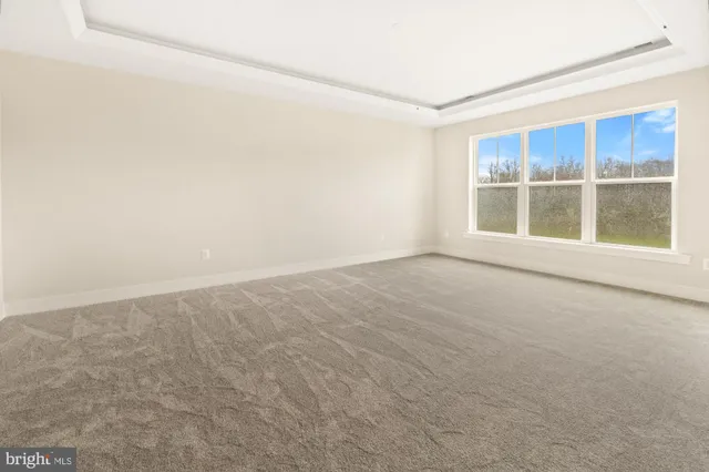 a view of empty room with windows