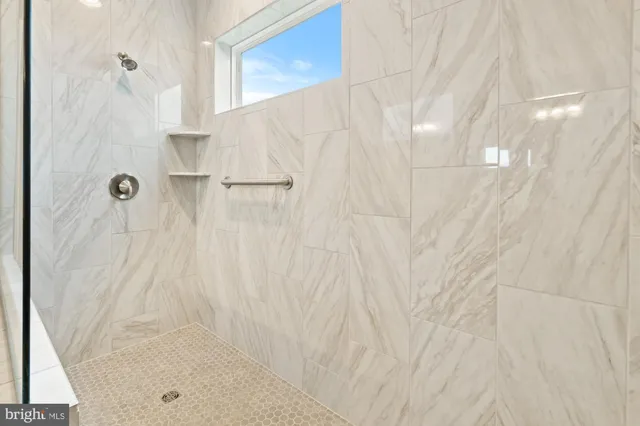 a bathroom with a sink vanity and mirror