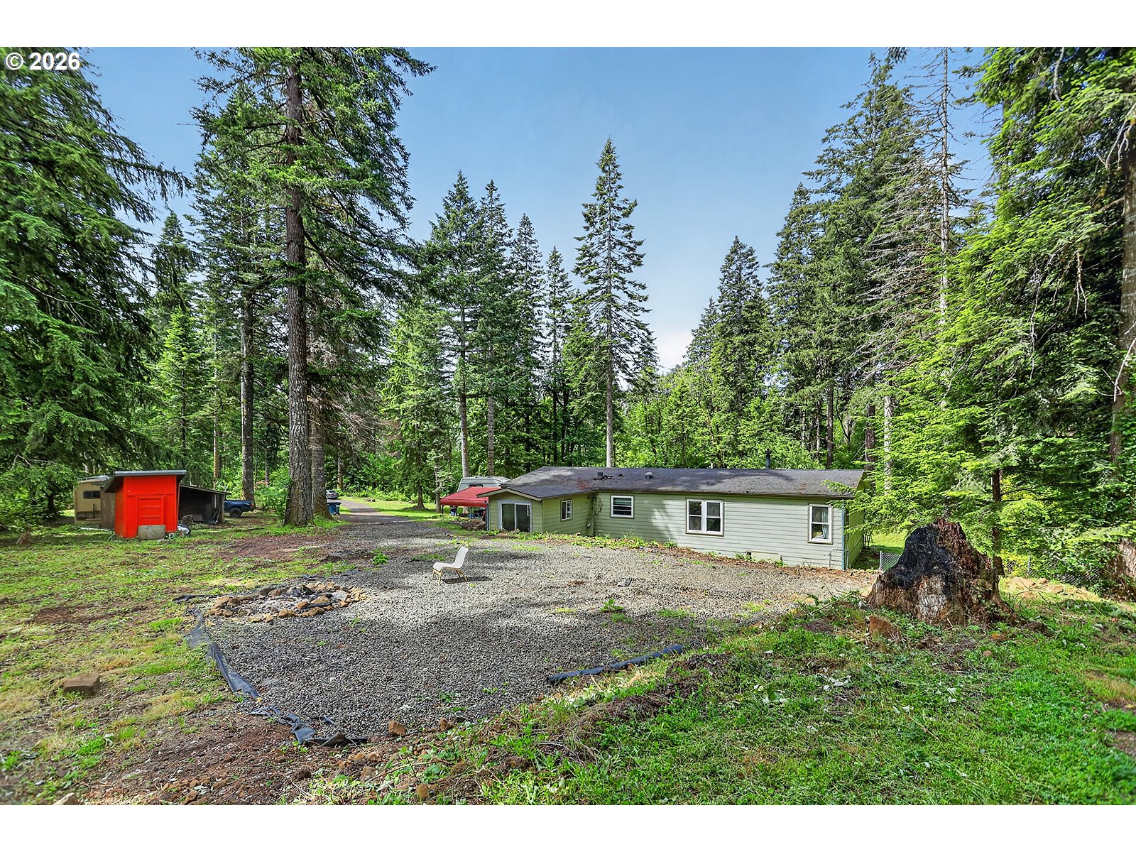 142 Spring Lane South Stevenson, WA 98648 - Photo 21 of 29 a view of a house with backyard and a tree