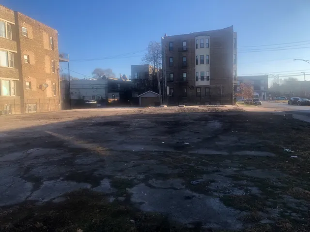 a view of building with a garden